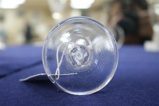 An 18th century firing glass, c.1760, with flared rim bowl and gauze column, encircled by twist opaque stem, 4.5in.